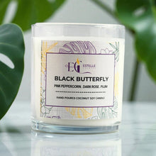 Load image into Gallery viewer, Candle labeled 'Black Butterfly' by Estelle Creates with decorative packaging on a light background. Pink peppercorn dark Rose plum