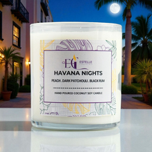 Load image into Gallery viewer,  'Havana Nights' candleon a reflective surface with a nighttime outdoor setting.
Peach, dark plum, black rum