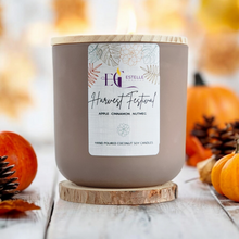 Load image into Gallery viewer, Tan Luxury Candle Jar  with a white background  with pumpkins in the background. 
Coconut soy candle. apple, cinnamon nutmeg