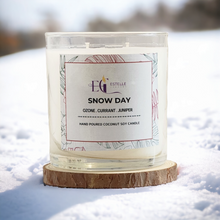 Load image into Gallery viewer, Candle labeled 'Snow Day' by Estelle Creates in the snow