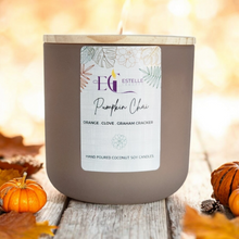 Load image into Gallery viewer, Tan Luxury Candle Jar  with a white background  with pumpkins in the background. 
Coconut soy candle, orange, clove graham cracker