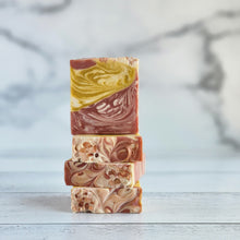Load image into Gallery viewer, Sea salt &amp; Orchid Three stacked bar soaps with varying colors of red, yellow, and white, with a swirled pattern. vegan